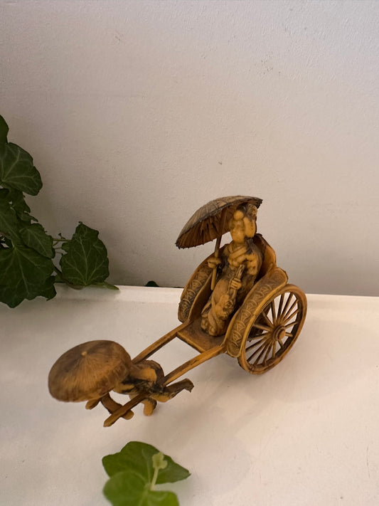 Vintage riksja beeldje