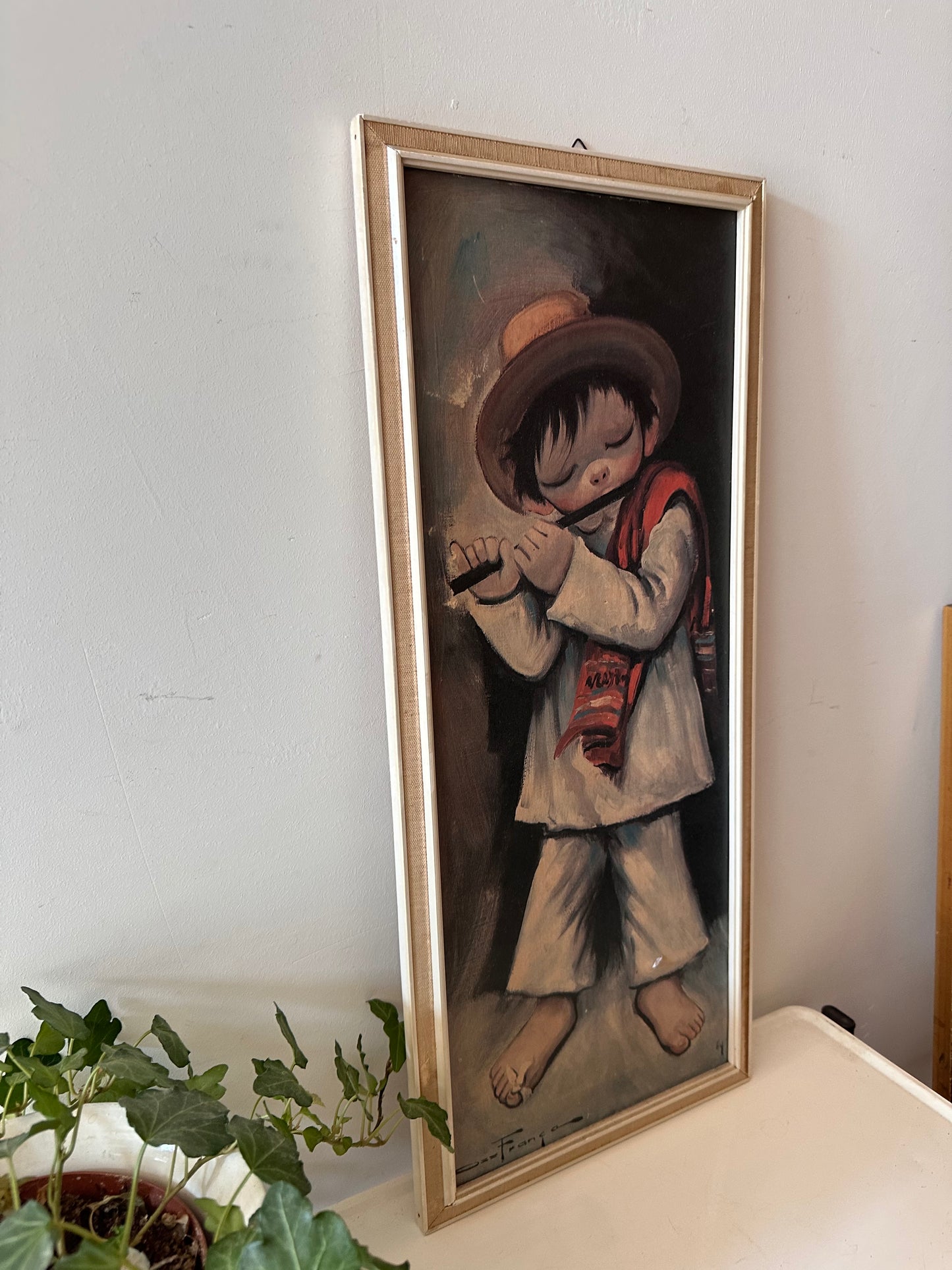 Schilderij met fluitend jongetje