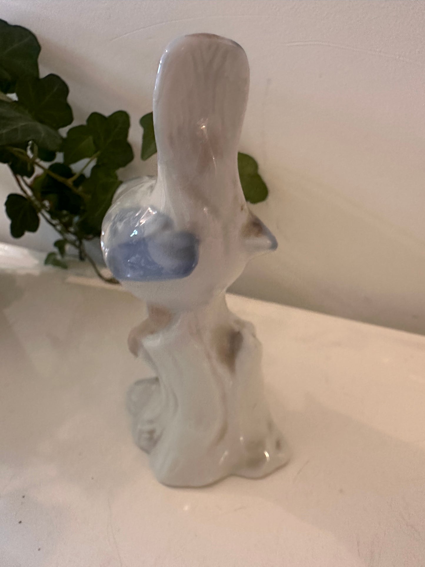 Porseleinen vogel beeldje