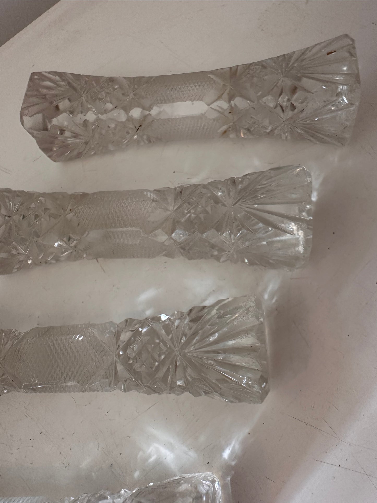 Set van 4 kristallen messenlegers