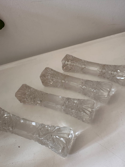 Set van 4 kristallen messenlegers