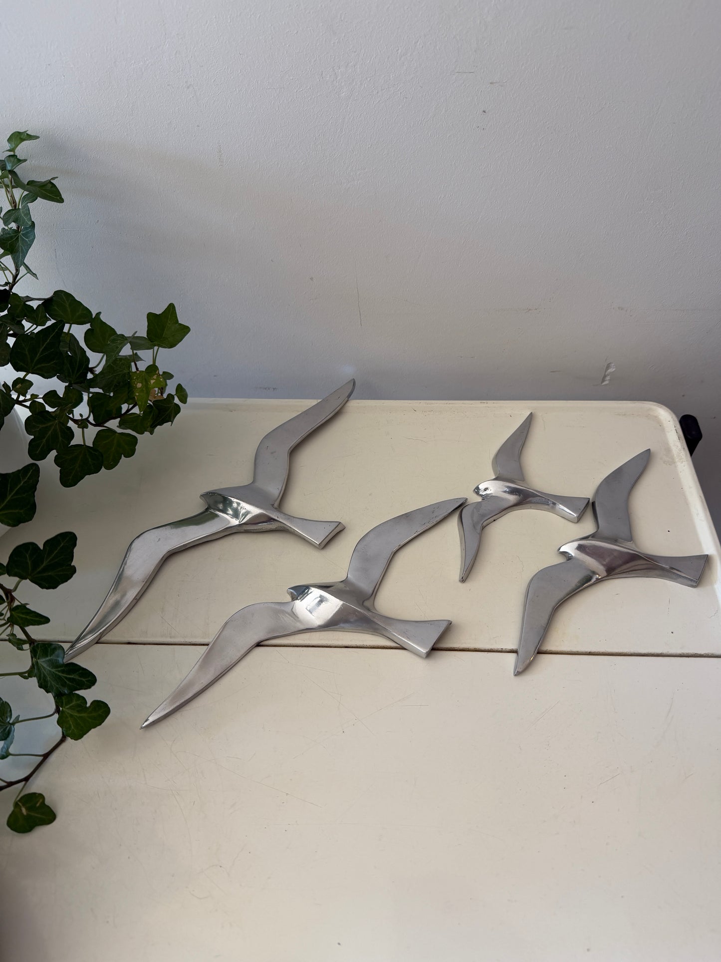 Lichtmetalen zwaluw voor aan de wand
