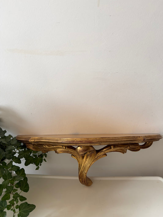 Goudkleurige wandconsole