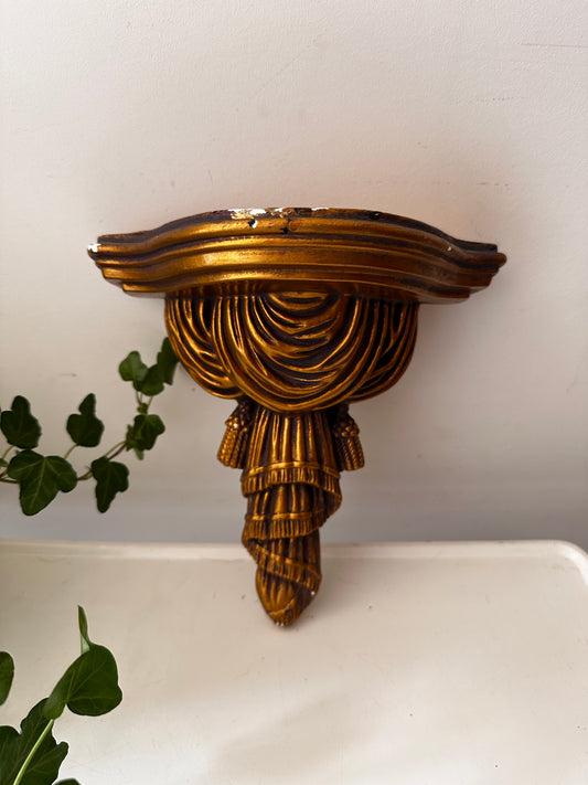 Goudkleurige wandconsole